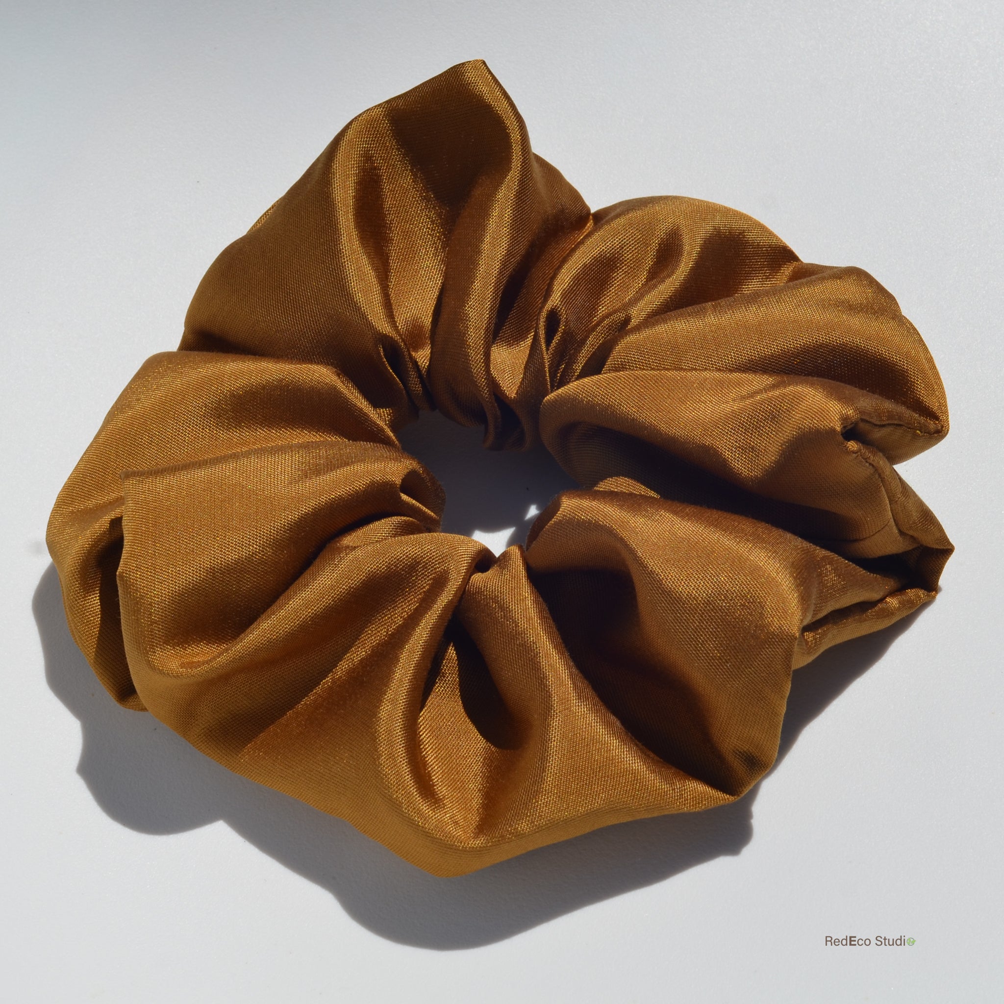 Brown scrunchie on a white background