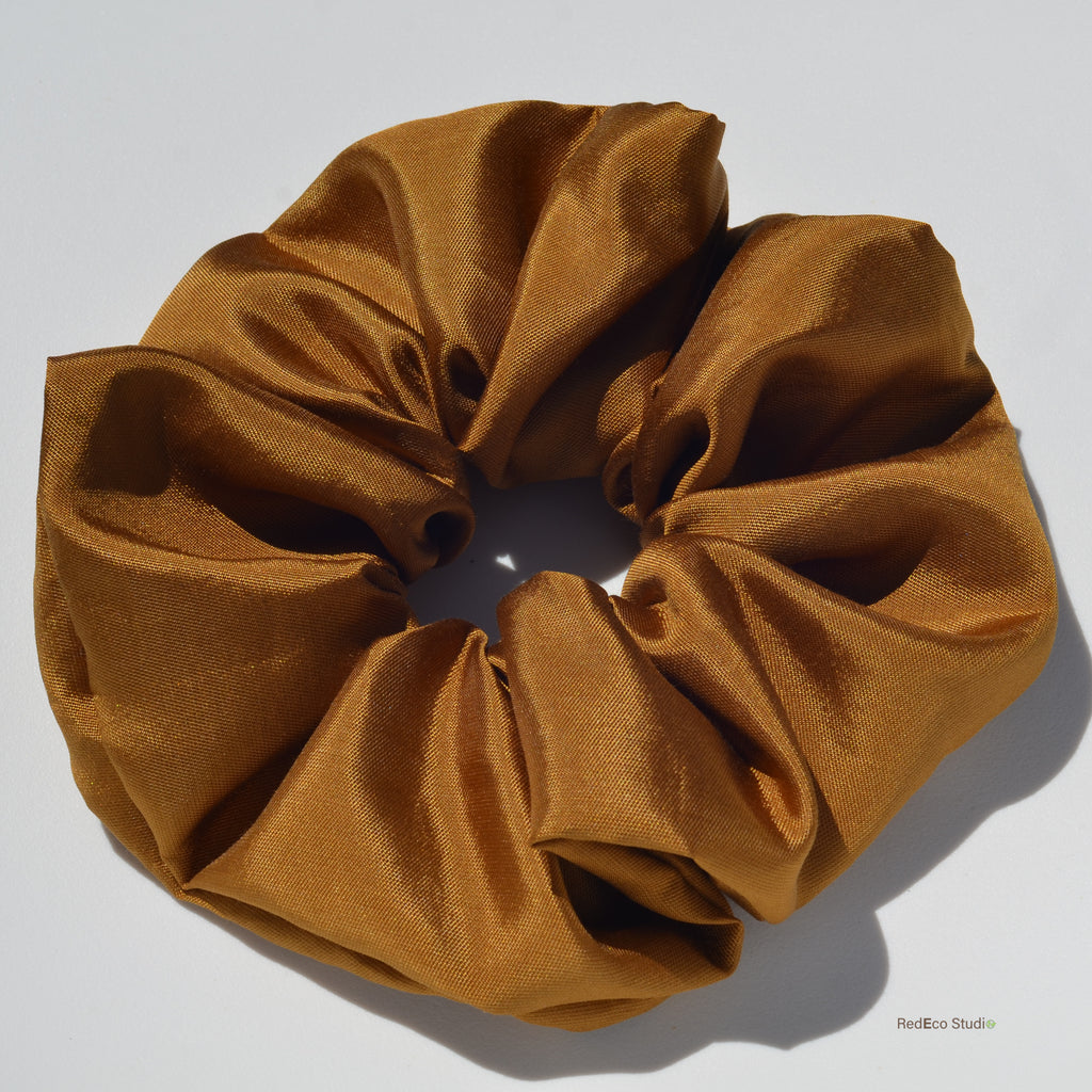 Brown scrunchie on a white background