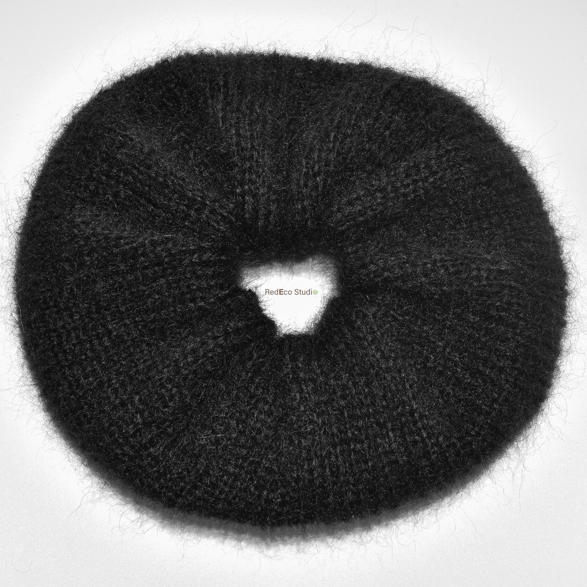 Black xl hand knitted scrunchie on a white background