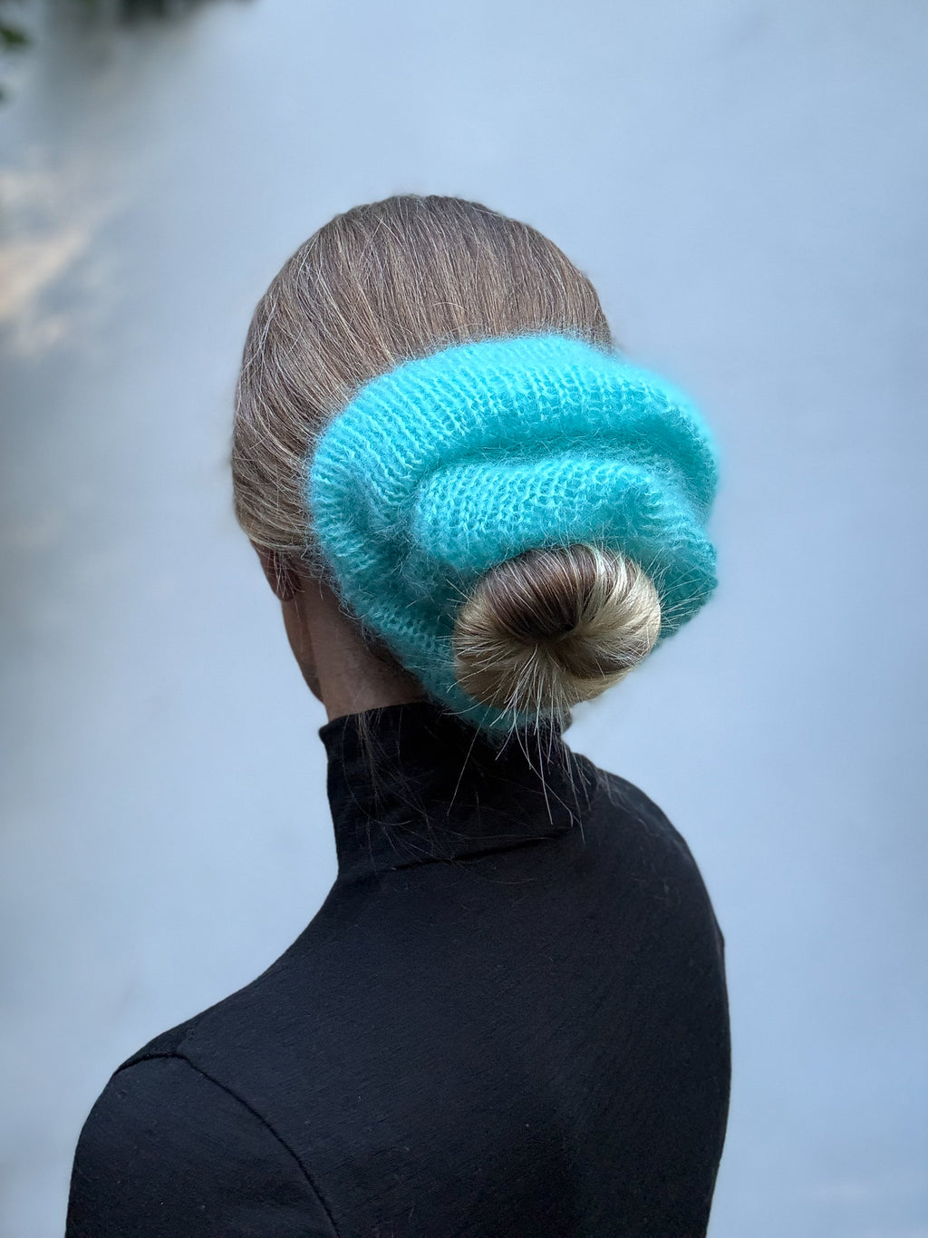 Oversized XL hand knitted silk mohair scrunchie in bright blue worn in low bun — handmade in Australia | RedEco Studio