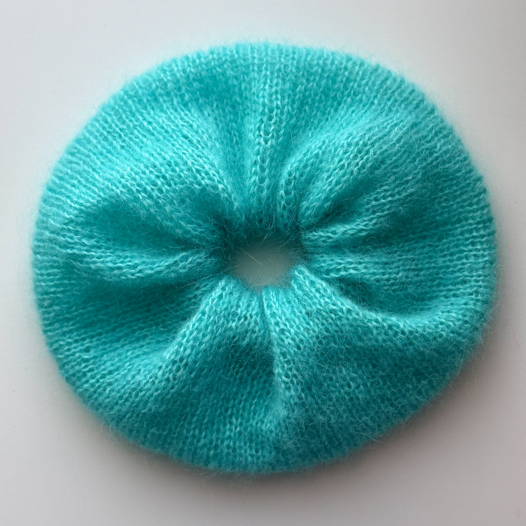 xl oversized blue knitted scrunchie against a white background