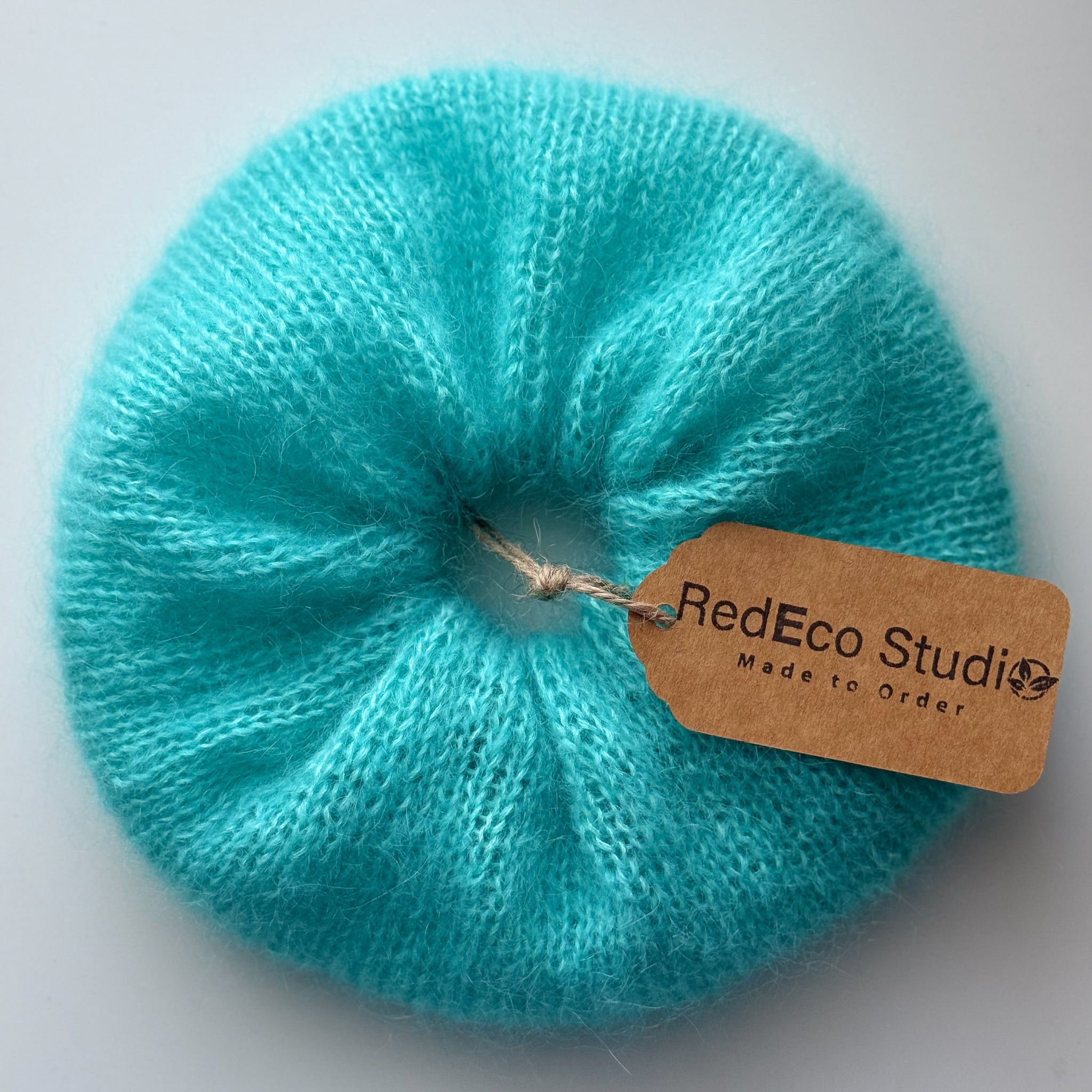 XL knitted scrunchie in bright blue with redeco studio tag attached