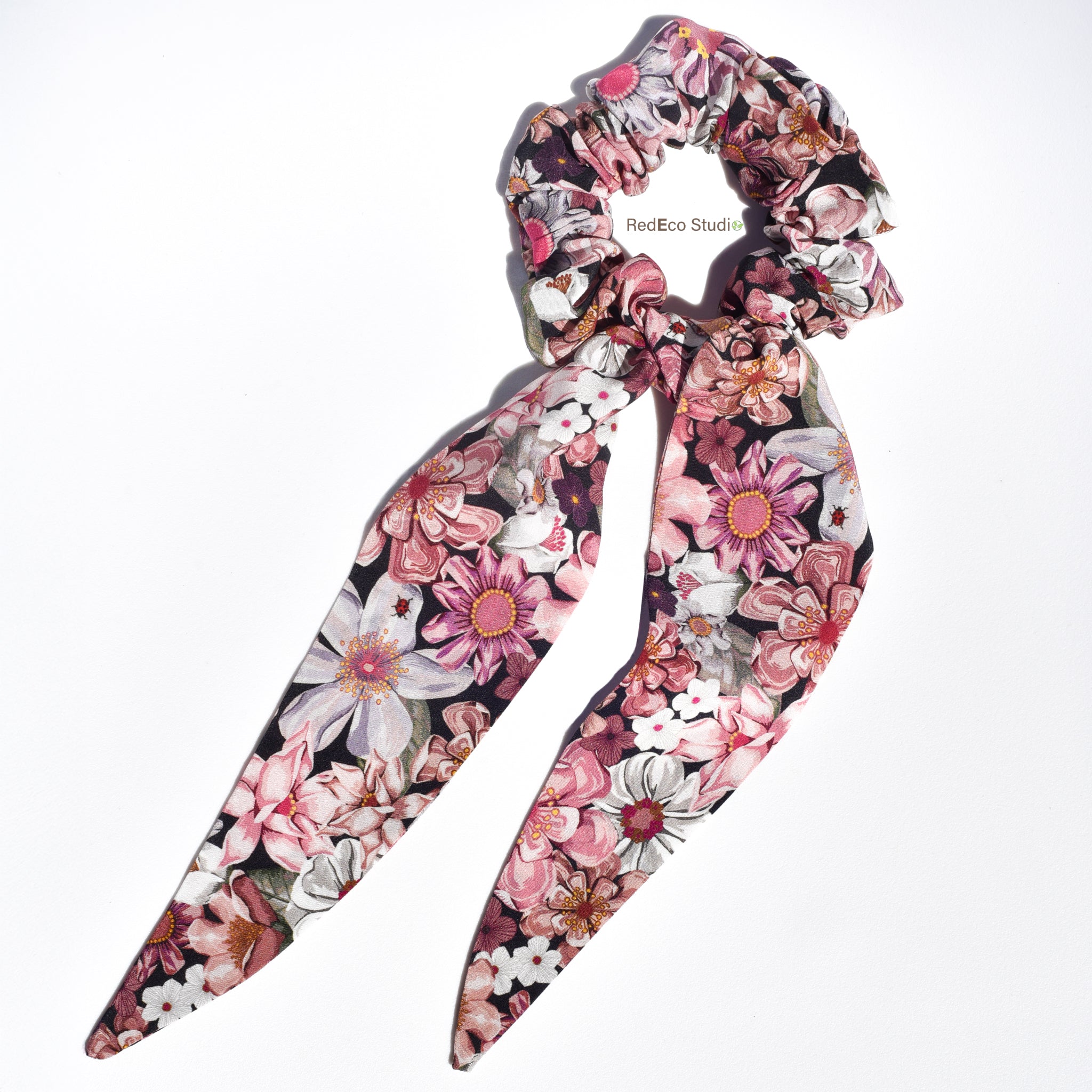 Large Floral silk scrunchie with pink and white flowers and long tails on a white background