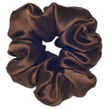 Brown satin scrunchie on a white background