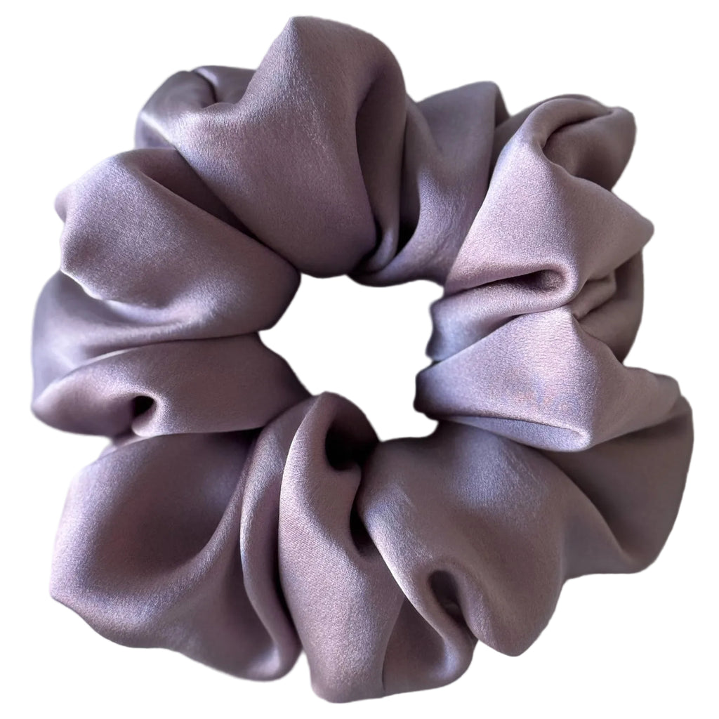 Purple scrunchie on a light gray background