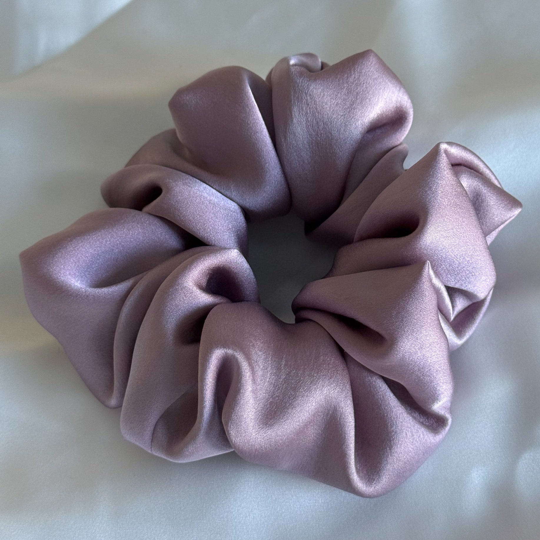 Pink scrunchie on a white background