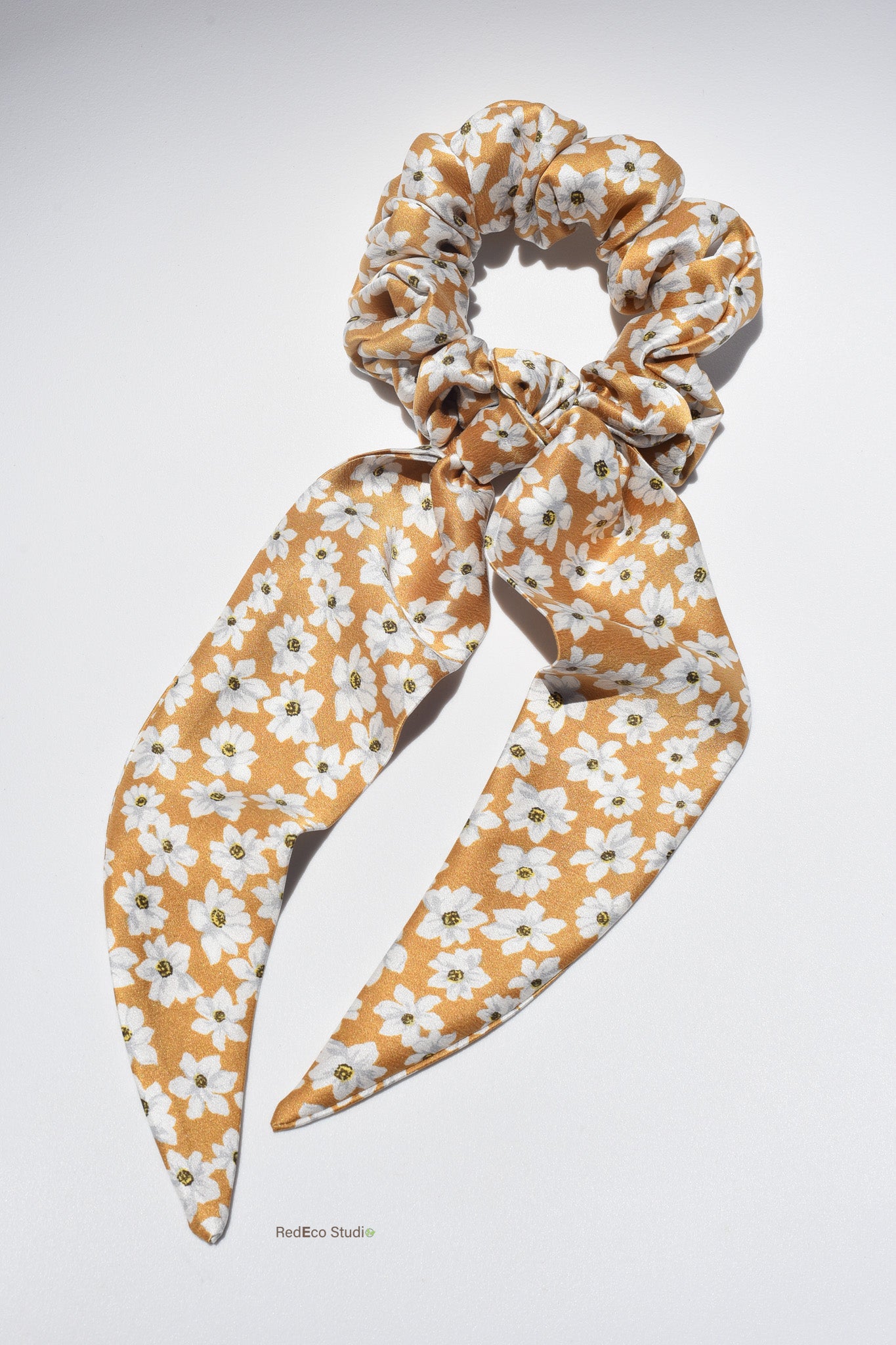 Regular sized floral silk scrunchie with long tails on a white background