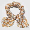 Small floral pure silk scrunchie with bow on a white background