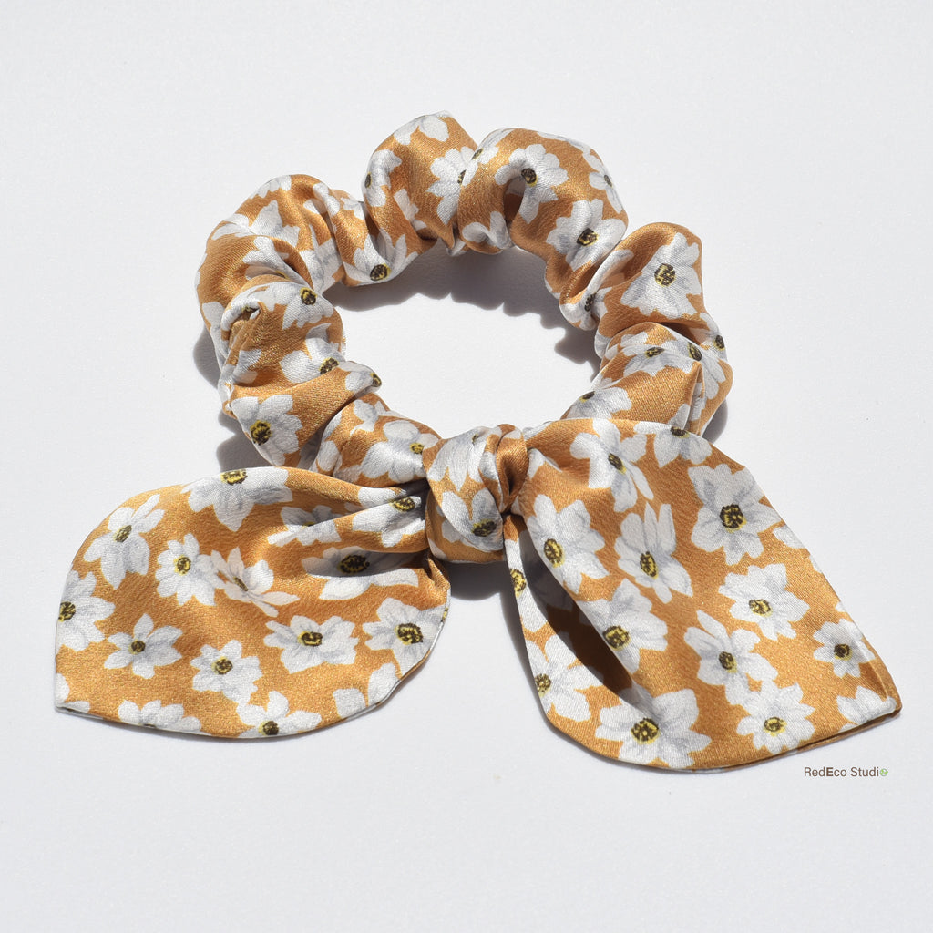 Mini floral silk scrunchie with bow on a white background