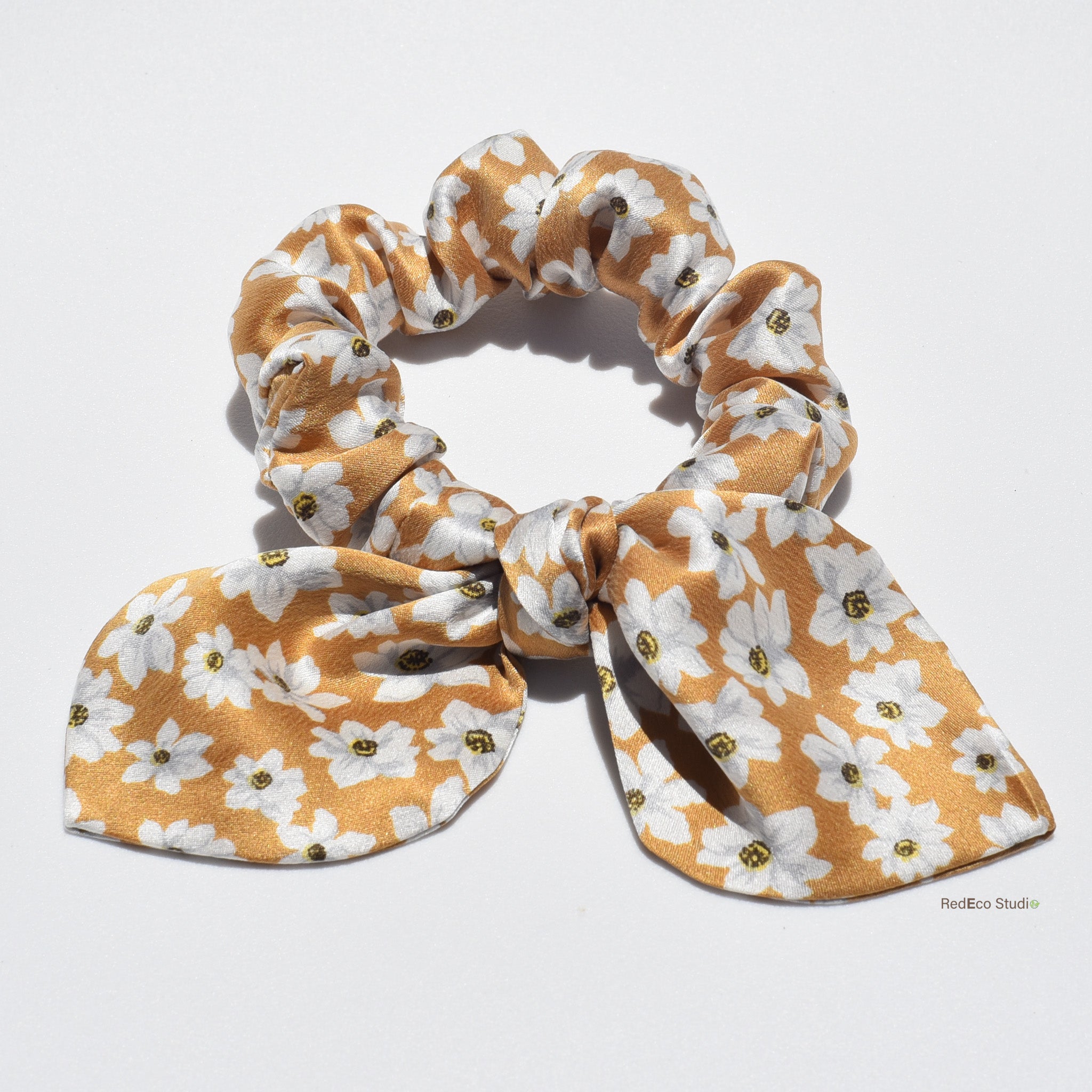 Mini floral silk scrunchie with bow on a white background