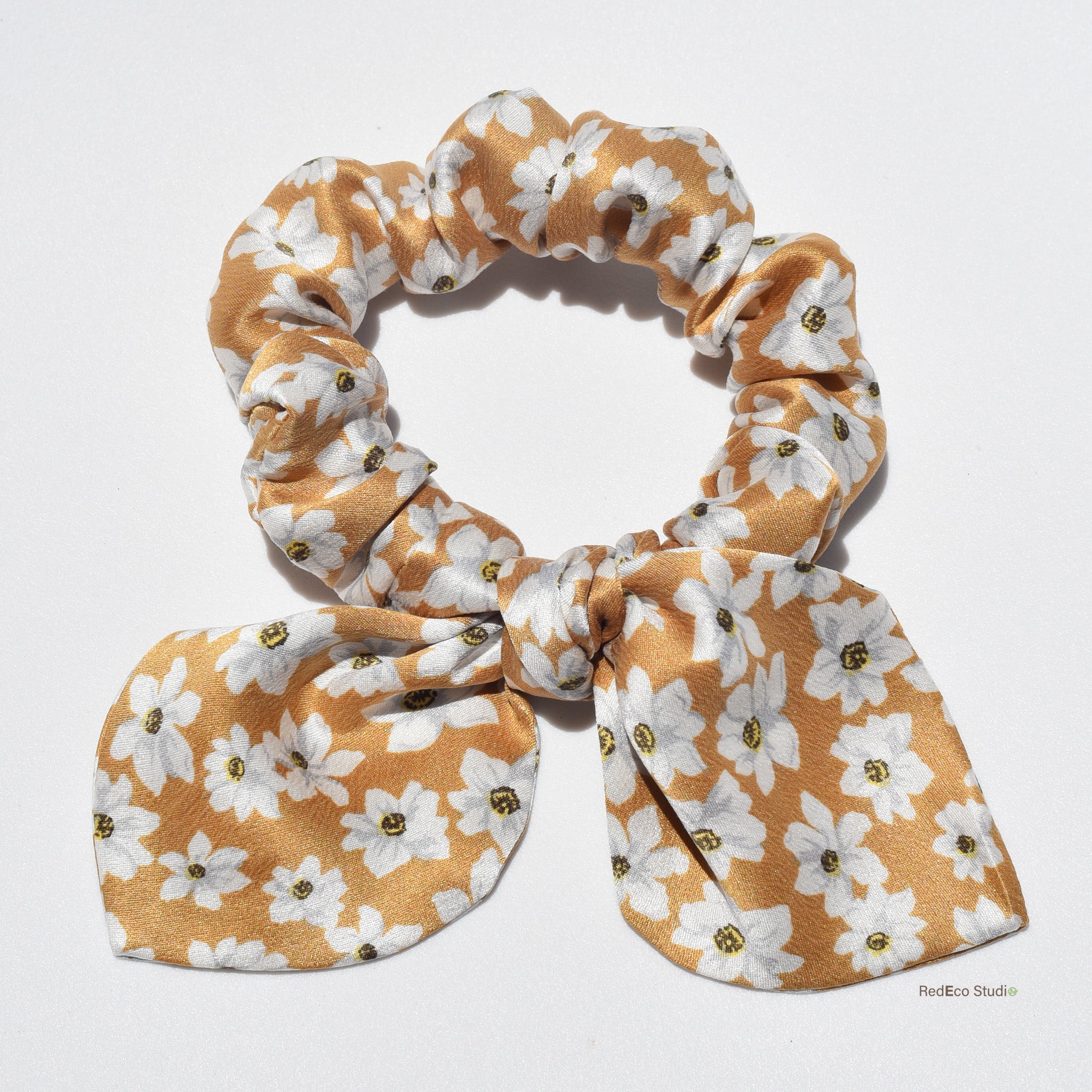 Floral silk scrunchie with bow on a white background