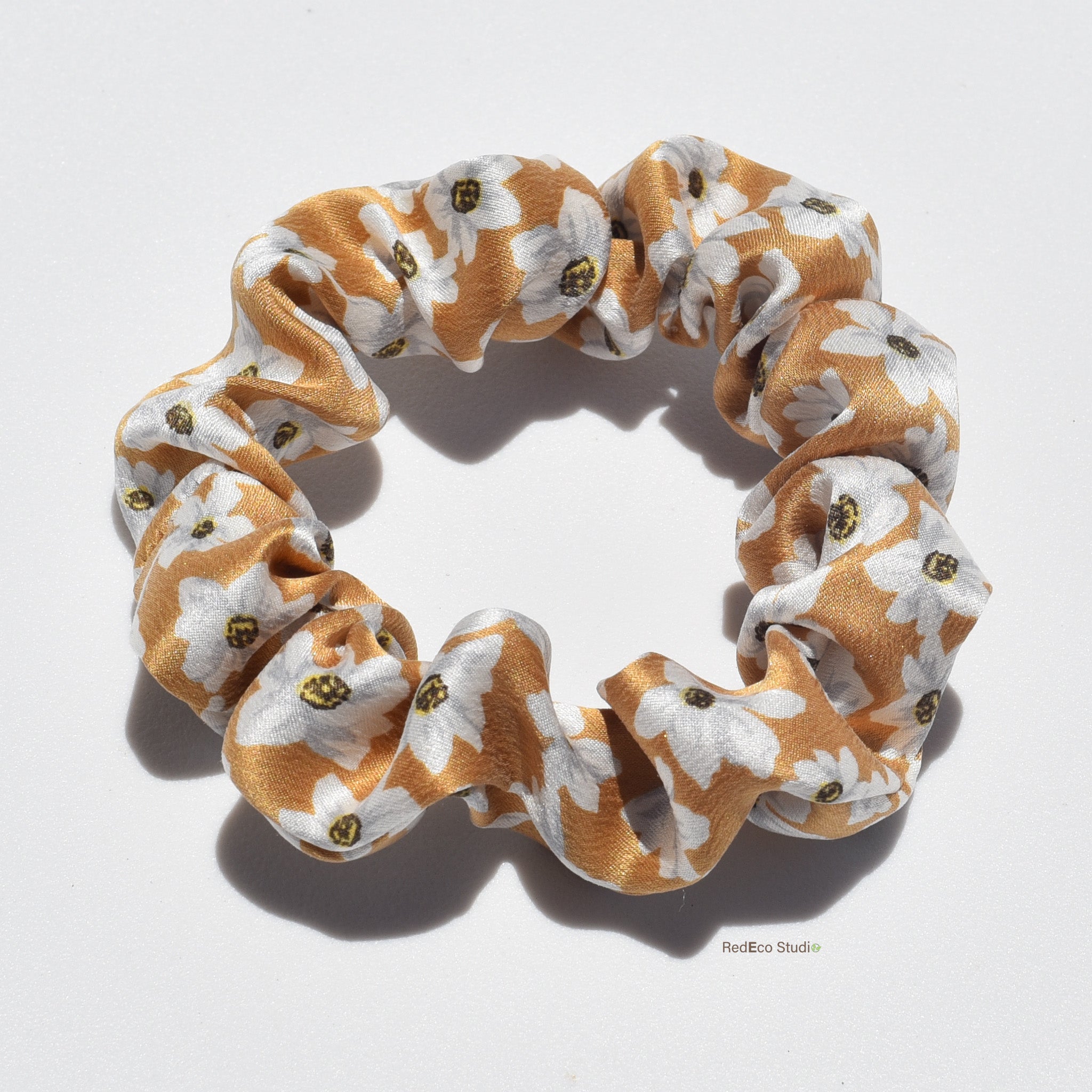 Mini floral patterned premium silk scrunchie on a white background