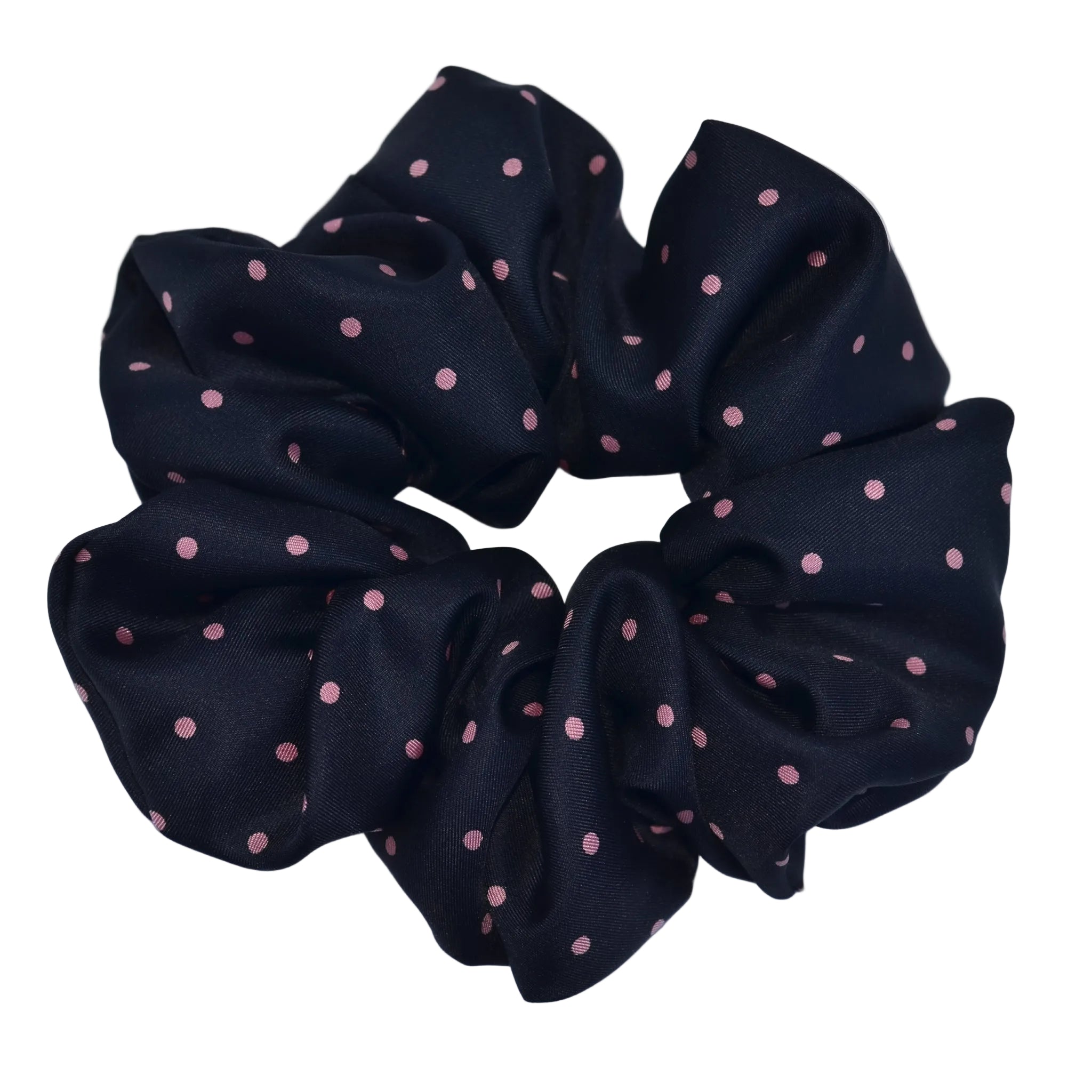 Black scrunchie with pink polka dots on a light blue background