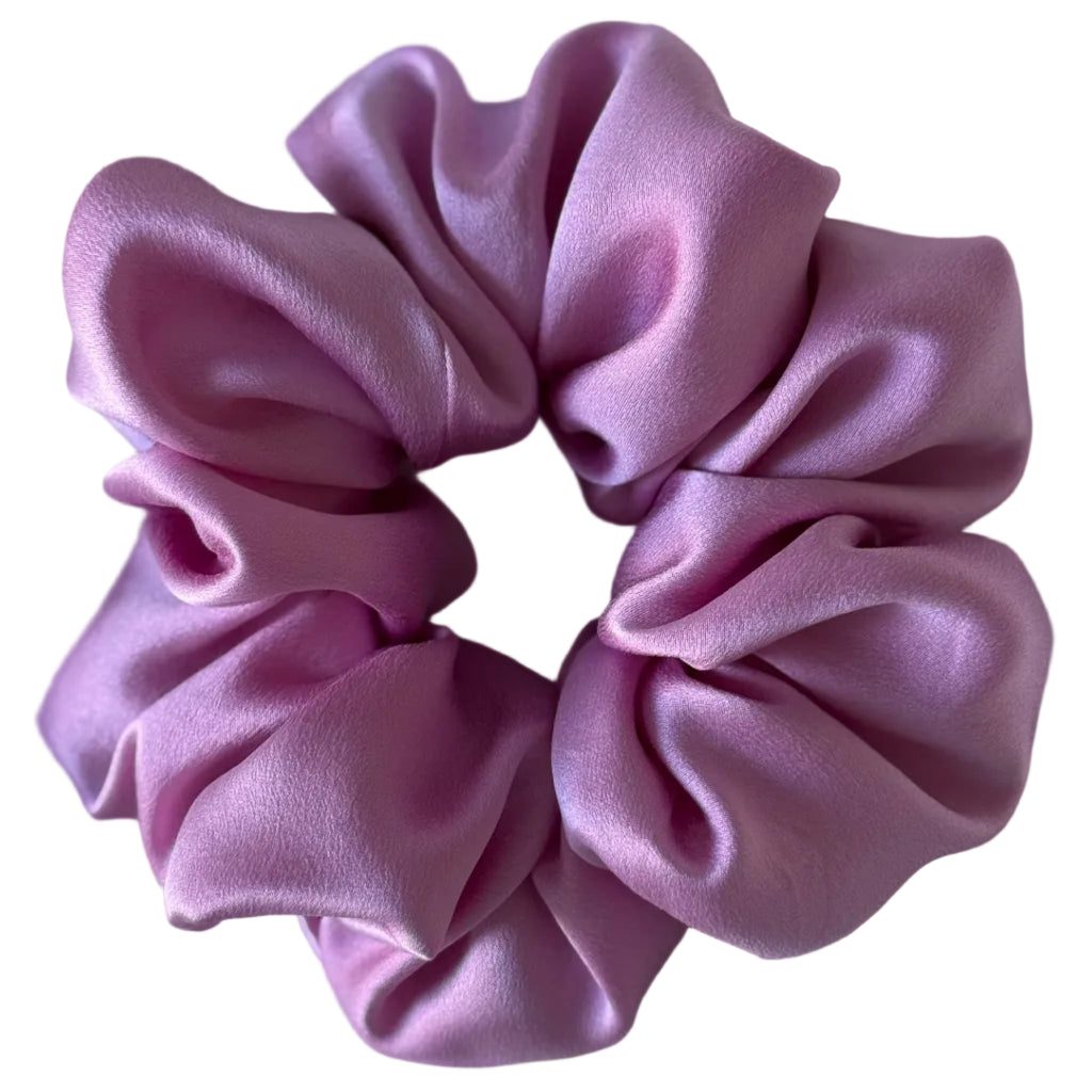 Pink scrunchie on a white background