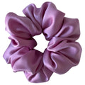 Pink scrunchie on a white background