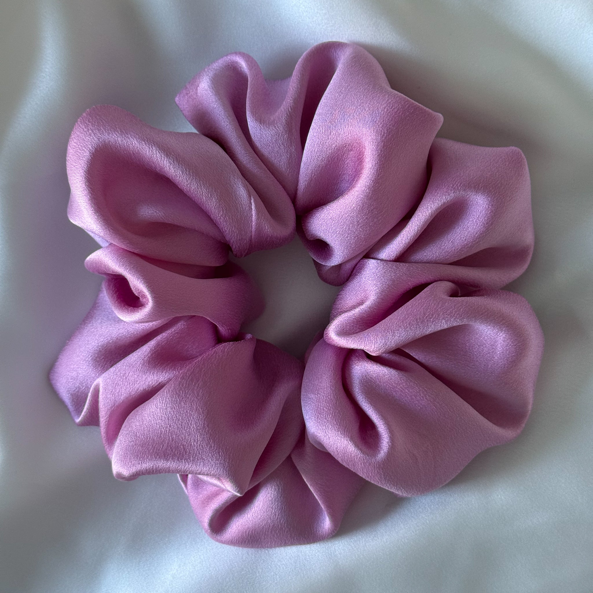 Large Pink silk scrunchie on a white background