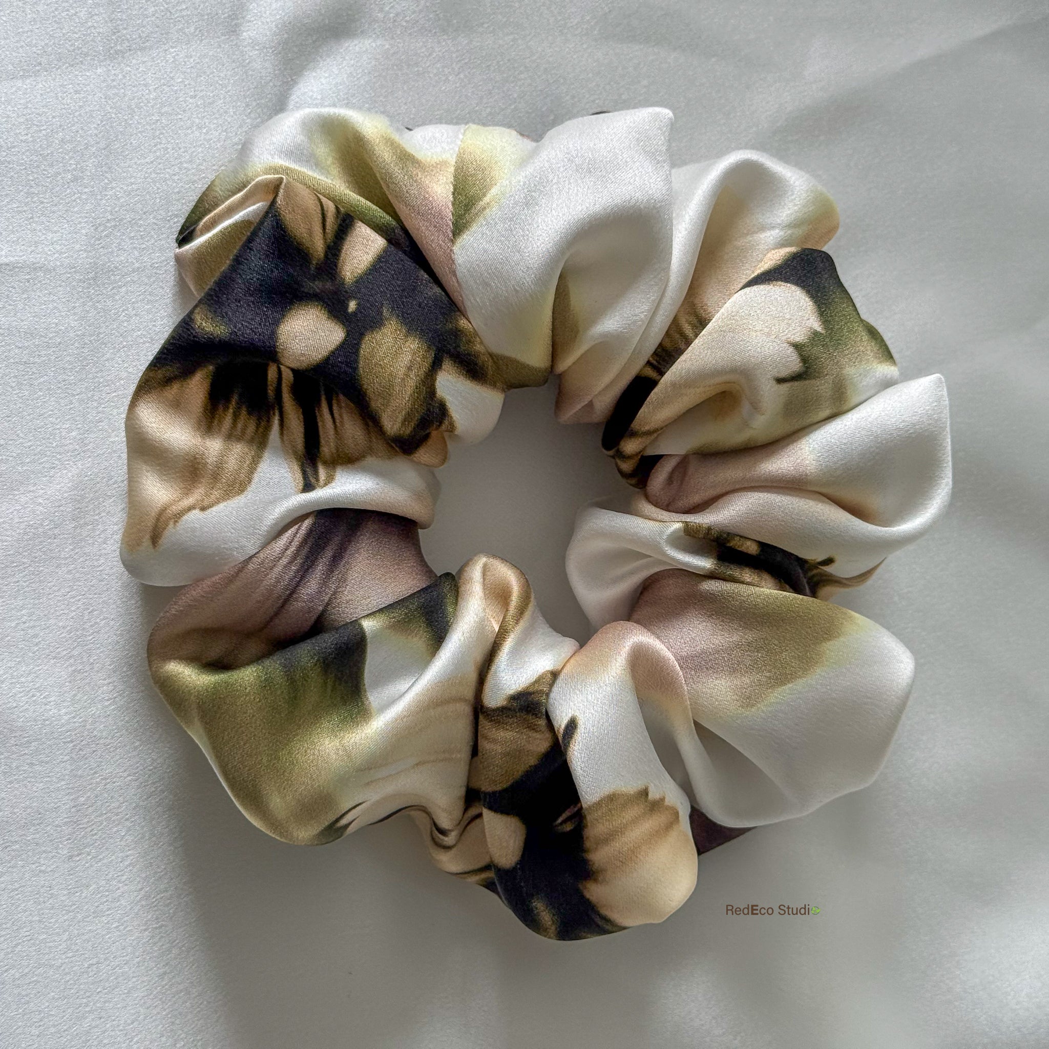 Multicolored scrunchie on a light gray background