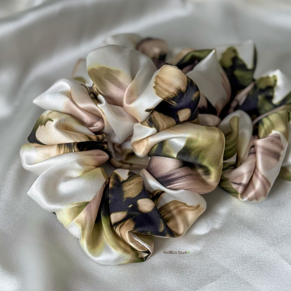 Floral silk scrunchies on a white background
