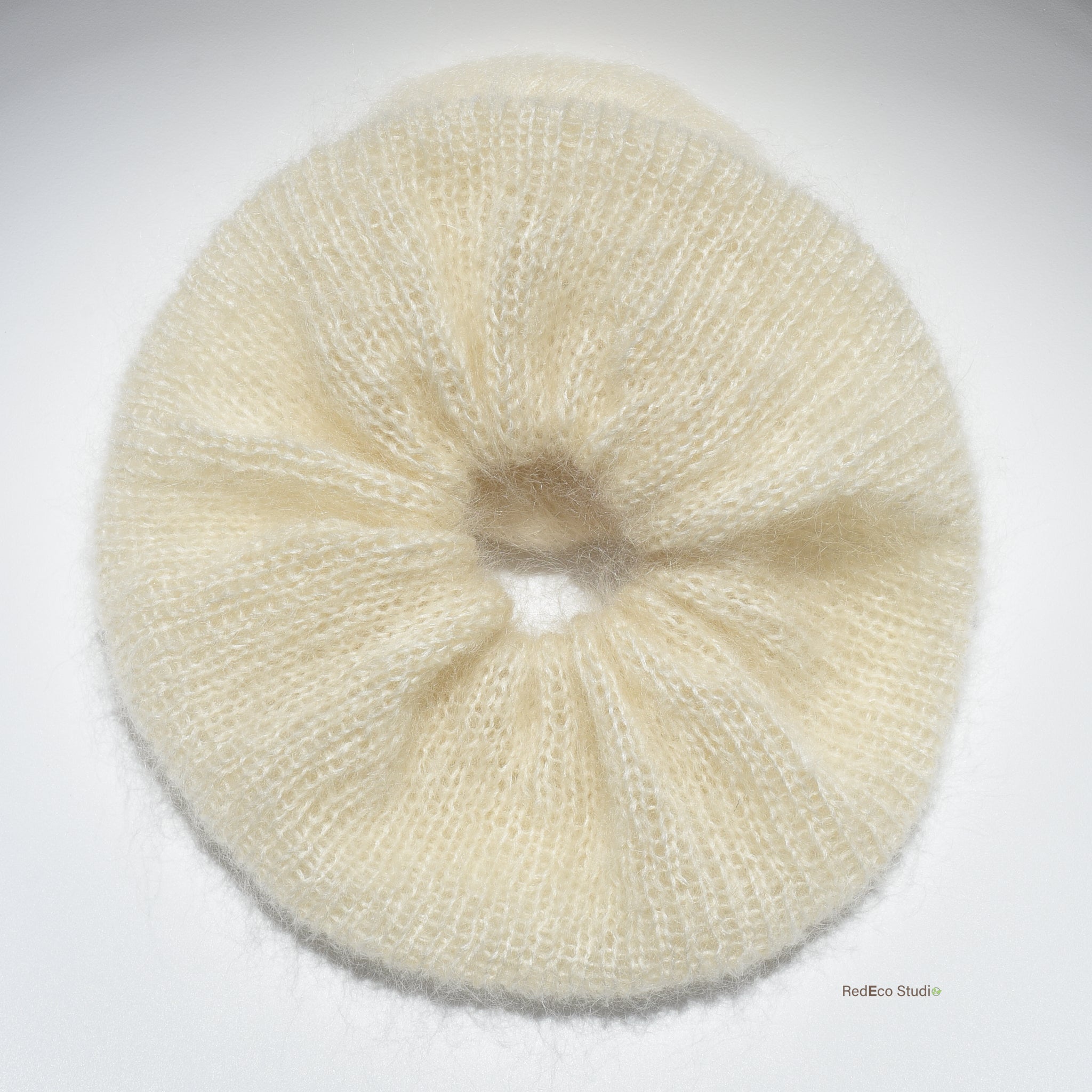 Cream xl hand knitted scrunchie on a white background