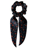 Ember Rose classic silk scarf scrunchie with long detachable tails, flat lay showing orange rosebuds and sage leaves on black