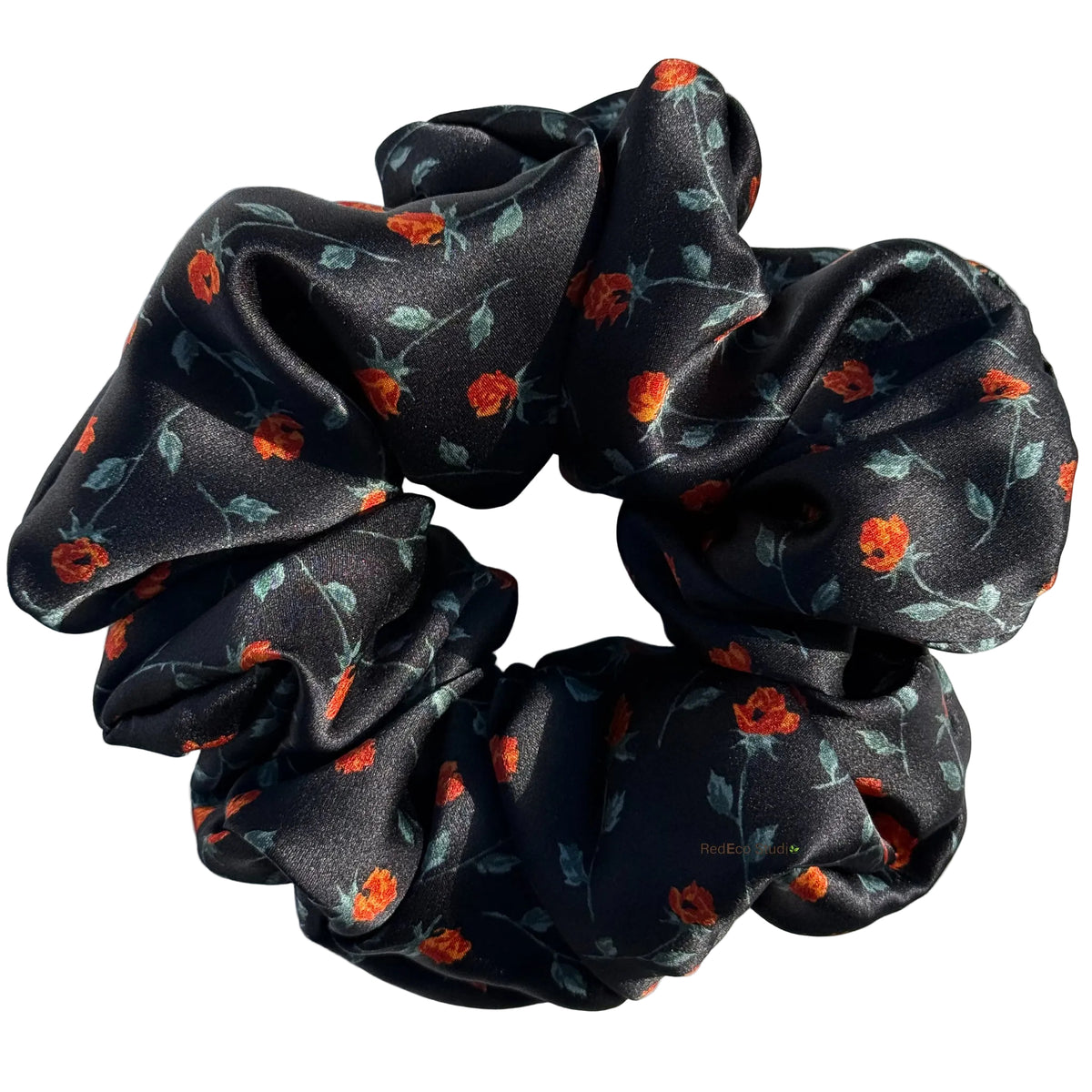 Ember Rose oversized silk satin scrunchie with tiny orange rosebuds and sage leaves on black, flat lay