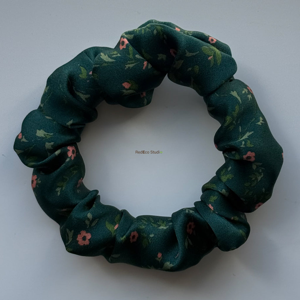 Emerald Posy mini silk scrunchie with the bow removed, flat lay in emerald green silk satin with coral flowers