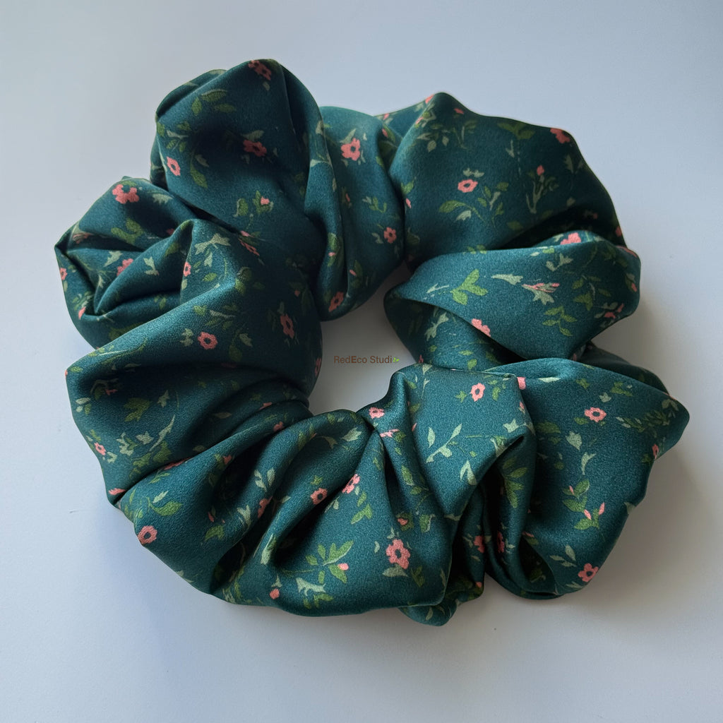 Emerald Posy oversized silk scrunchie, angled view showing the satin sheen and full gathers of the green floral print
