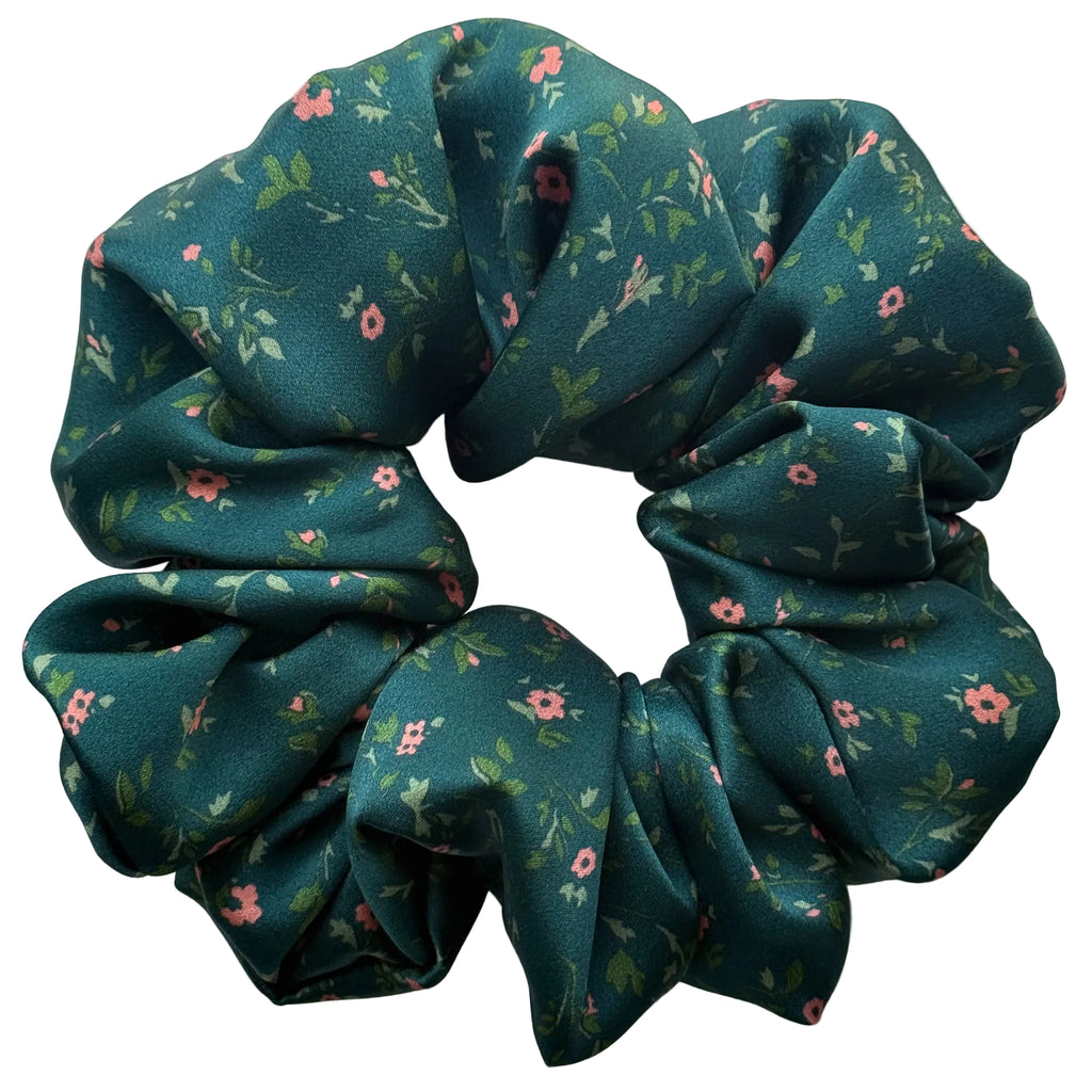 Emerald Posy oversized pure silk satin scrunchie, flat lay top view showing tiny coral flowers and leaves on deep emerald green
