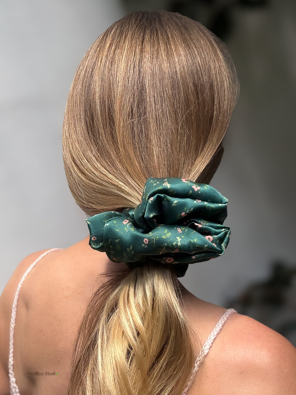 Emerald Posy oversized silk satin scrunchie on a low ponytail, back view showing its generous size