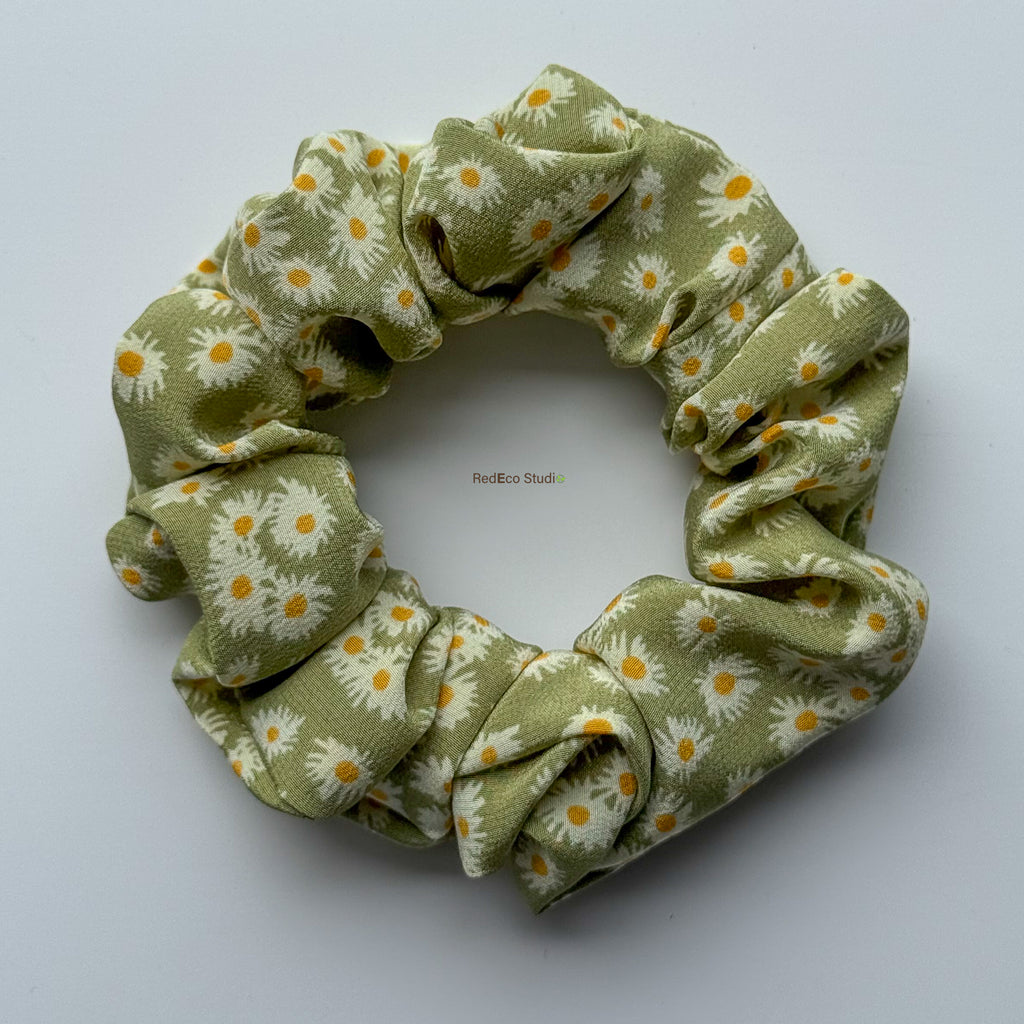 Matcha Daisy classic silk scrunchie with the tails removed, flat lay showing the green daisy print
