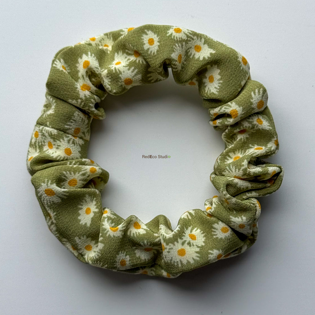 Matcha Daisy mini silk scrunchie with the bow removed, flat lay showing the green daisy print