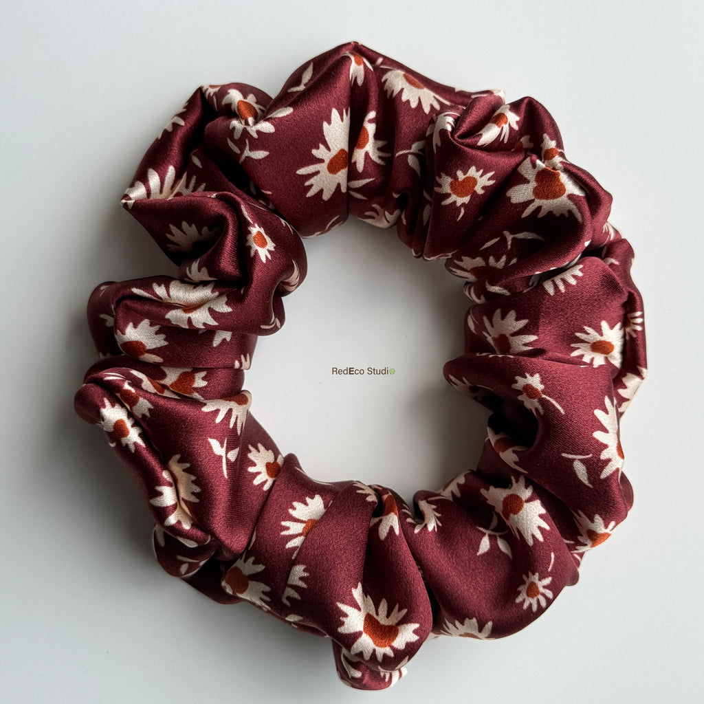 Merlot Daisy classic silk scrunchie with the tails removed, flat lay showing the burgundy daisy print in 19 momme silk satin