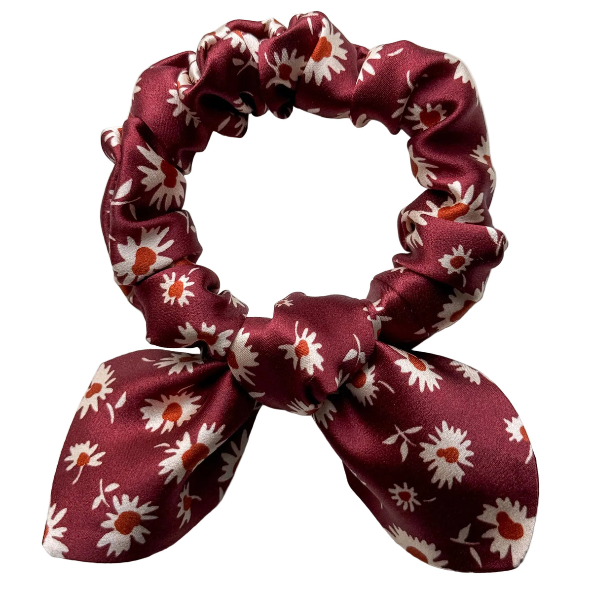 Merlot Daisy mini silk bow scrunchie, flat lay top view showing cream daisies with rust-orange centres on burgundy satin