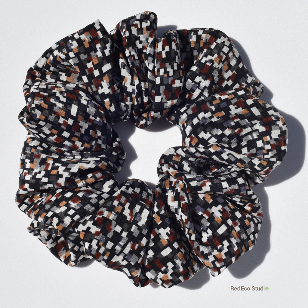 Large patterned silk scrunchie on a white background