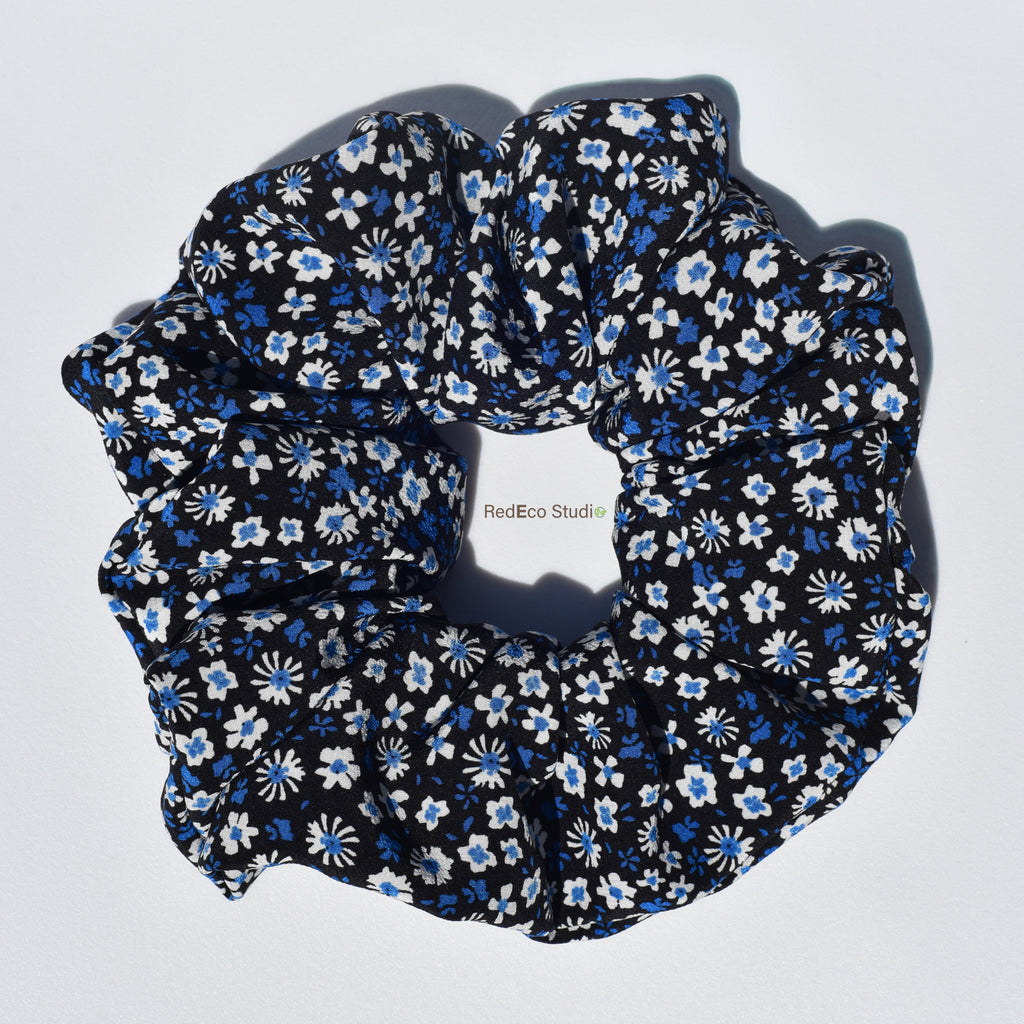 Large floral patterned silk scrunchie on a white background