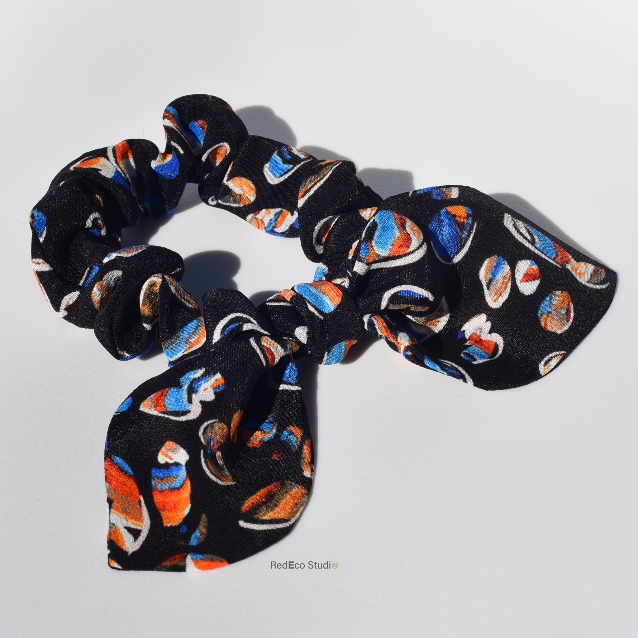 Mini 100% Silk Bow Scrunchie - Pebbles on a navy blue base
