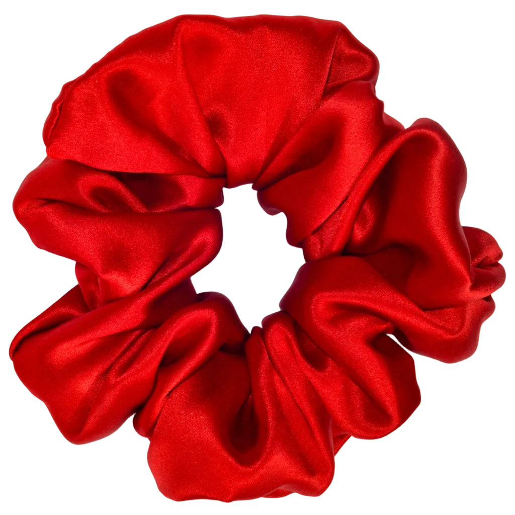 Red satin scrunchie on a light gray background