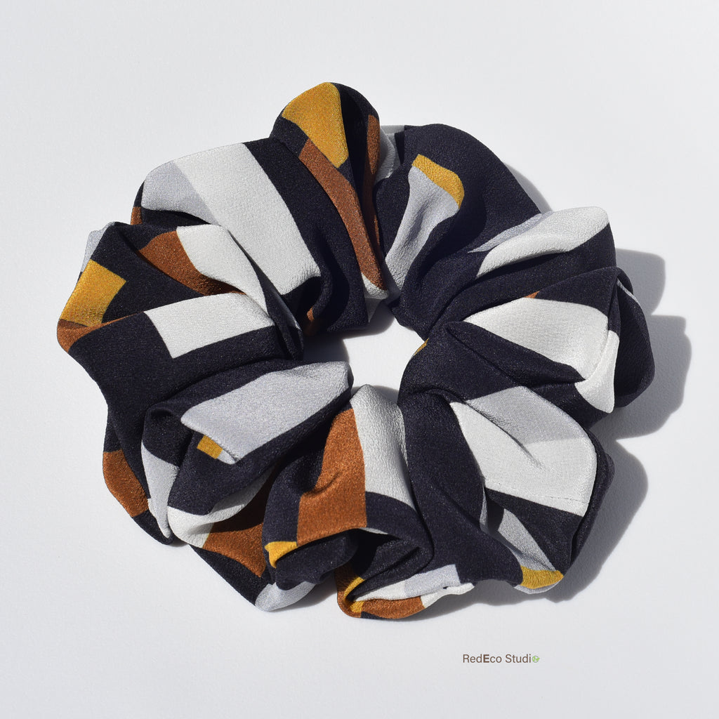 Multicolored silk scrunchie on a white background