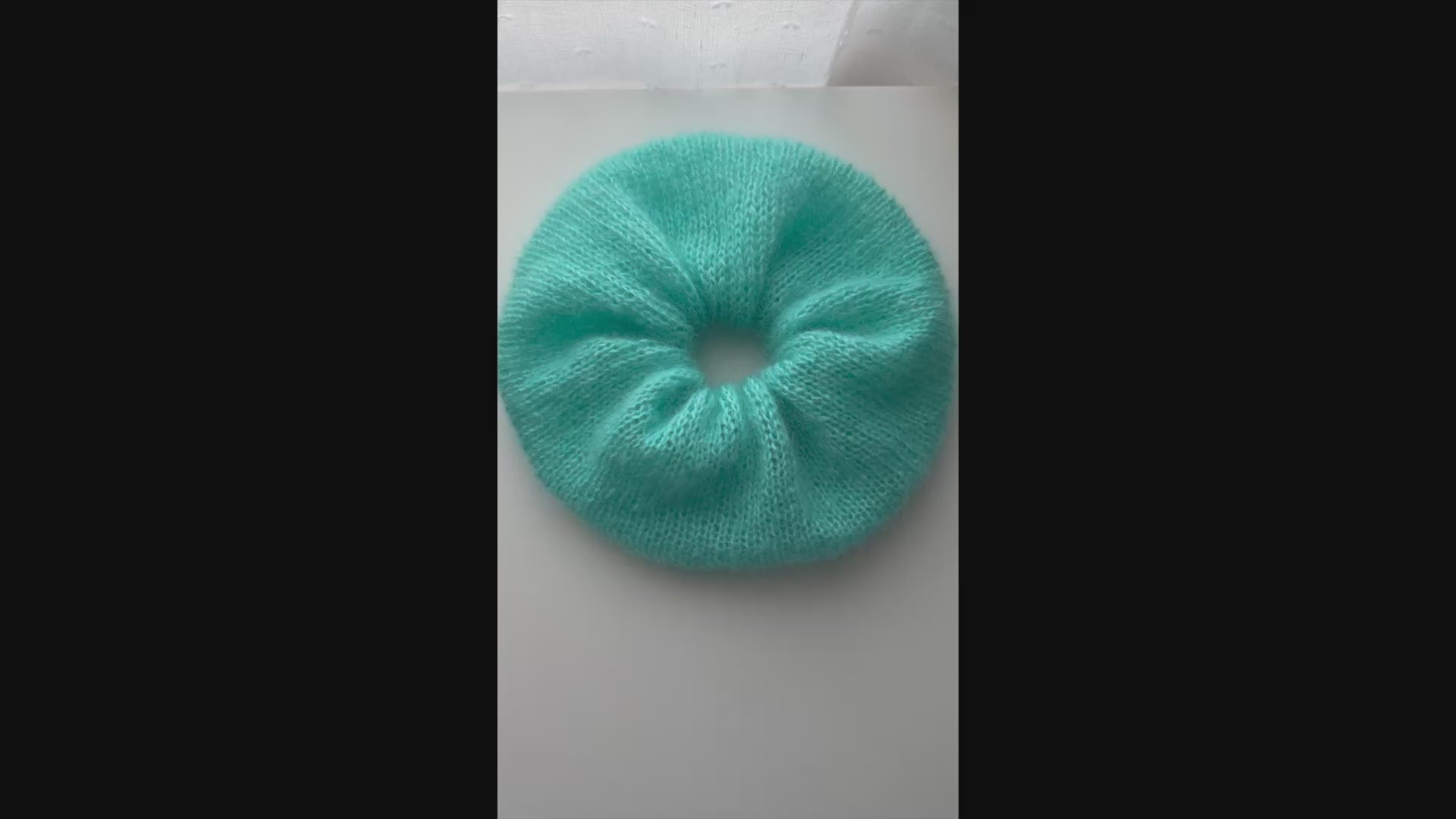 close-up video of texture of mohair silk knitted scrunchie
