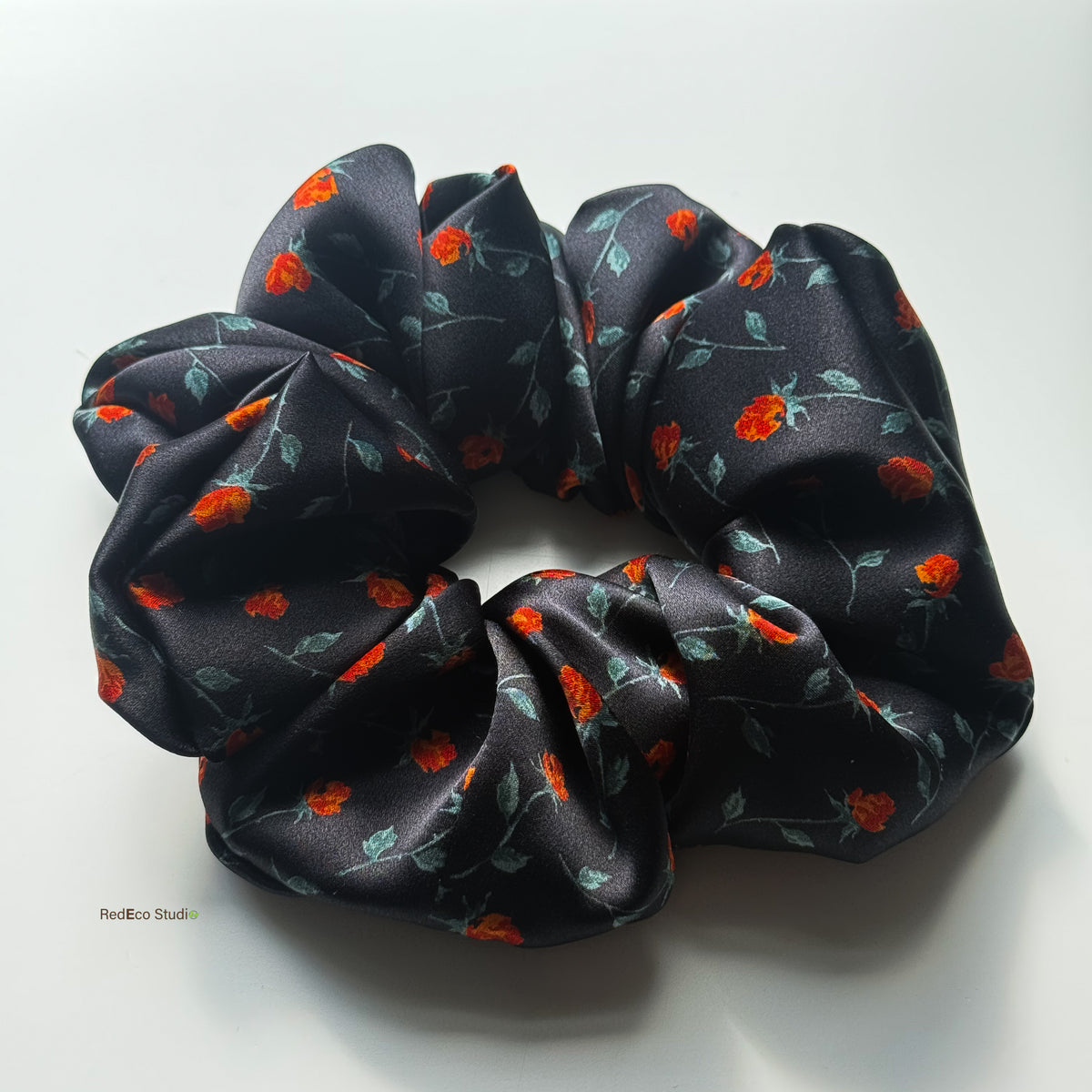 Rosebud Noir oversized silk scrunchie, side view showing its full gathers and satin lustre