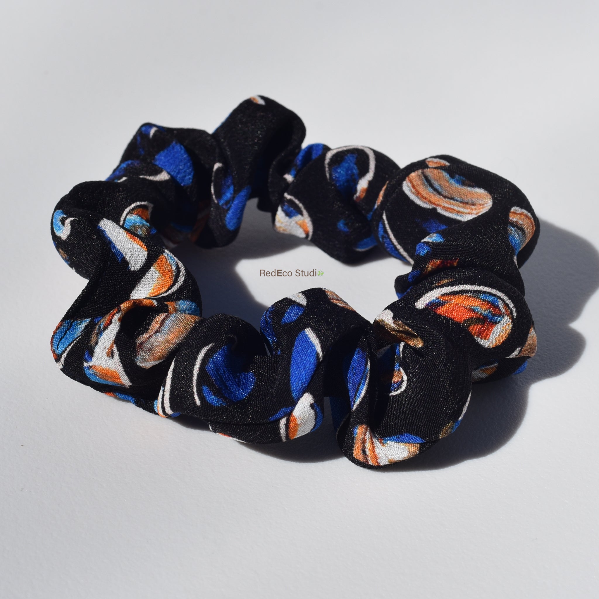 Mini 100% Silk Scrunchie - Pebbles on a navy blue base