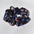 silk scrunchie with colorful pattern on a white background