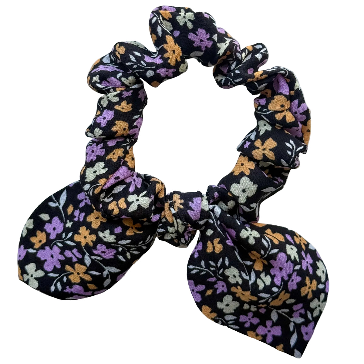 Violet Meadow mini silk georgette bow scrunchie laid flat, lilac, apricot and cream flowers on black with a detachable bow