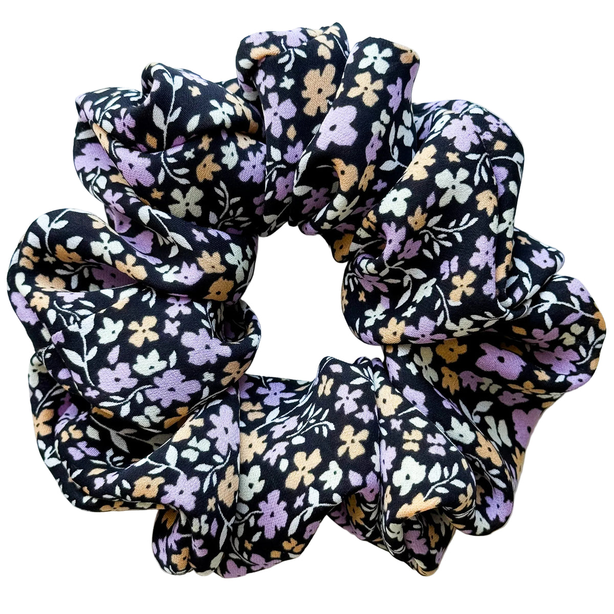 Violet Meadow oversized pure silk georgette scrunchie, flat lay top view showing lilac, apricot and cream flowers on black